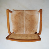 Wooden, goatskin and rattan Aspen armchair